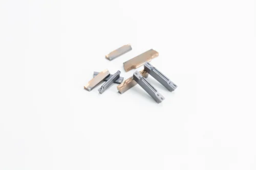 Cutting and grooving inserts
